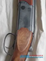 Beretta over/under shotgun with blued barrels