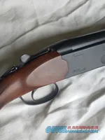 Beretta over/under shotgun with blued barrels